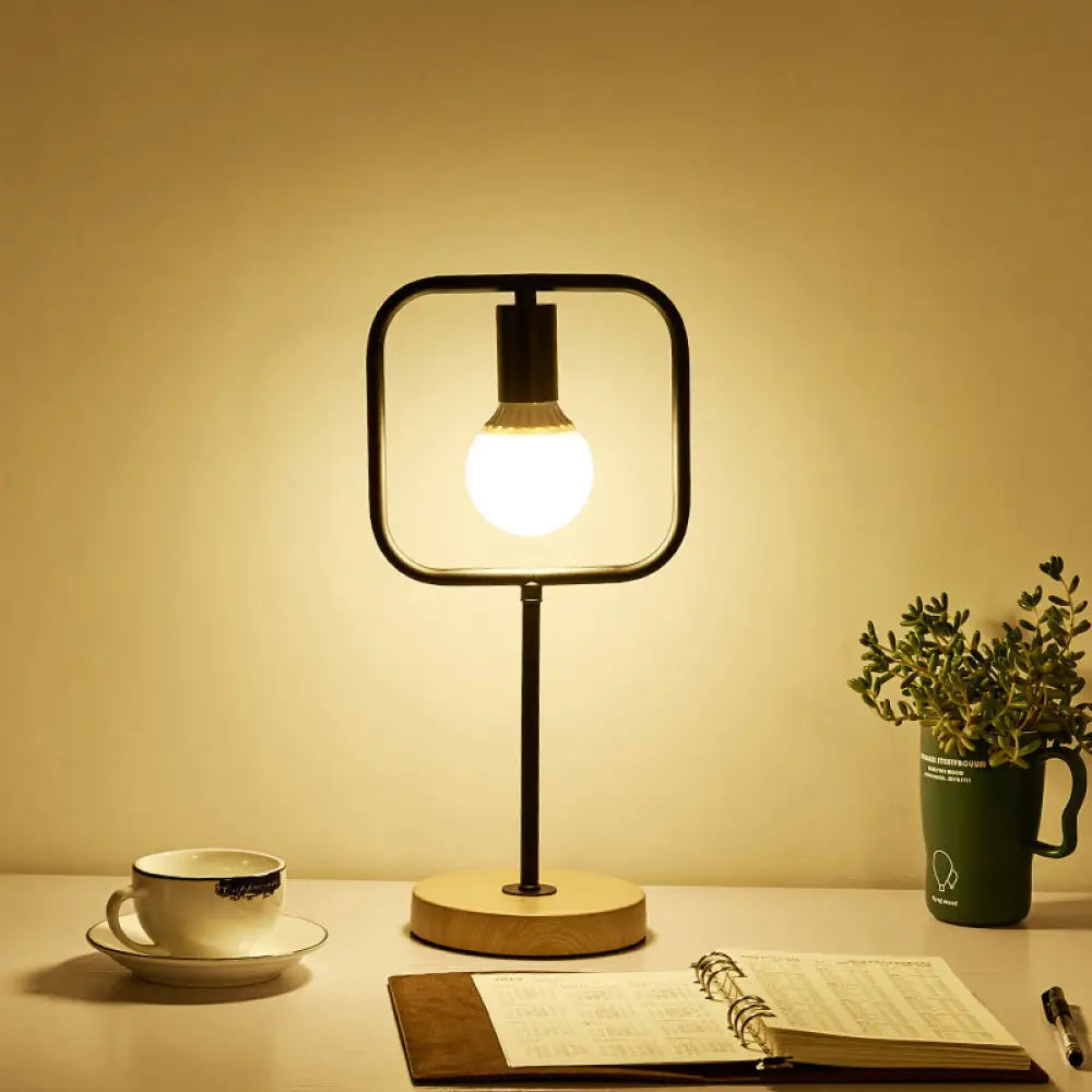 leather table lamps with a distressed texture for a rugged charmleather table lamps with a distressed texture for a rugged charmGeometric Frame Metal Table Lamp with Round Wooden Base - Stylish Industrial Bedside Night Light