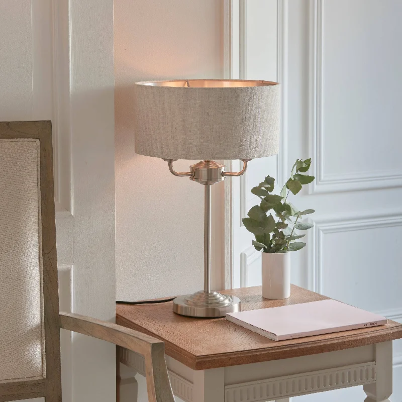 metal table lamps with a matte black finish for a sleek appearancemetal table lamps with a matte black finish for a sleek appearanceHighclere 3-Light Table Lamp with Natural Linen Shade